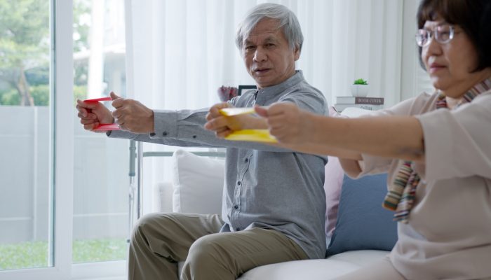 Young,Older,Senior,Asia,Citizen,Couple,Sit,On,Sofa,Couch