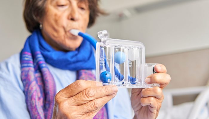 Spirometer,For,Breathing,Exercises.,Senior,Woman,In,Hospital,Room,Practicing